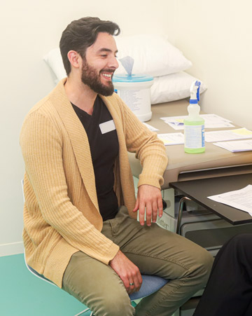 Smiling man in clinical setting