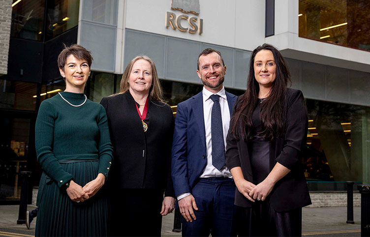 Four individuals stand outside 26 York Street