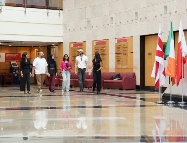Students taking a guided tour through the university main atrium.