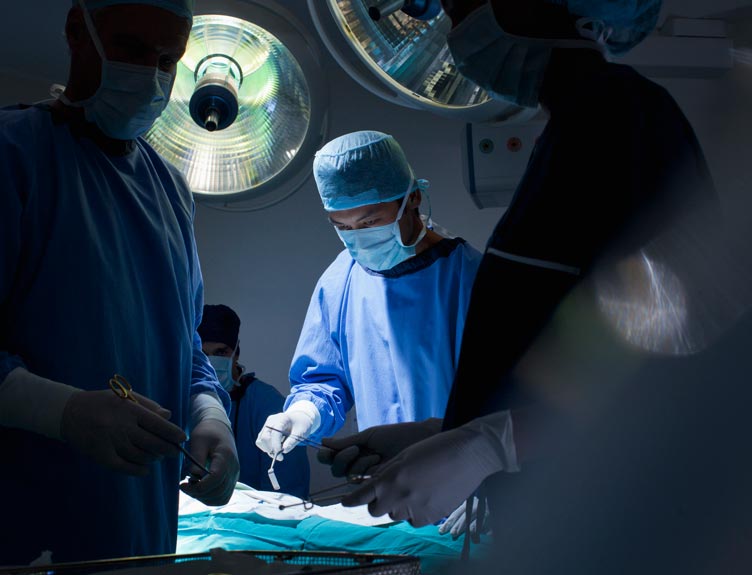 Surgeons while operating