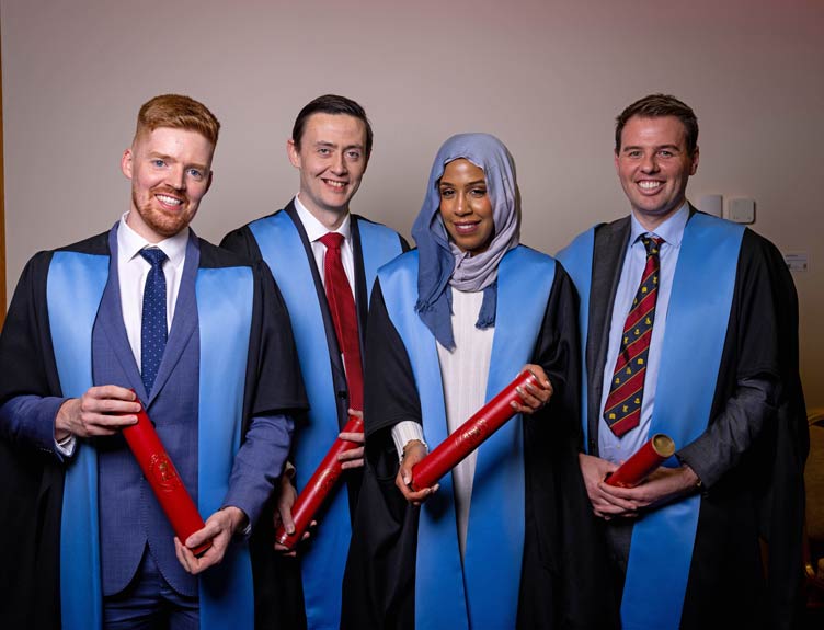 December conferring A happy group of graduates in gowns