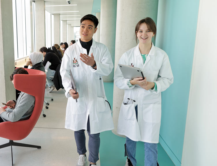 Two students in lab coats at RCSI's 26 York Street