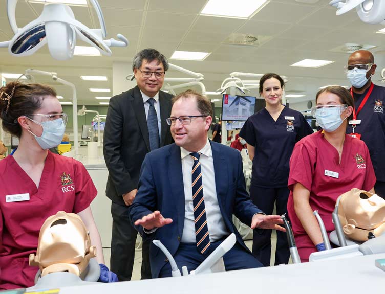 Professor and Minister with RCSI Dentistry students during launch