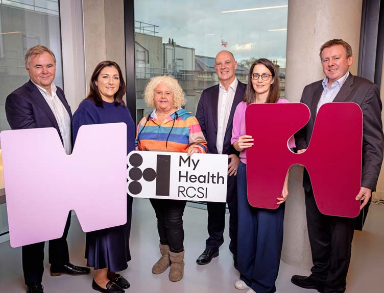 Six people pose with signing to promote RCSI MyHealth event