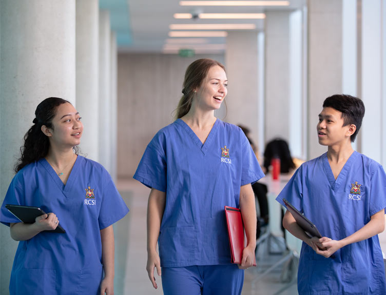 Three medical students in hall