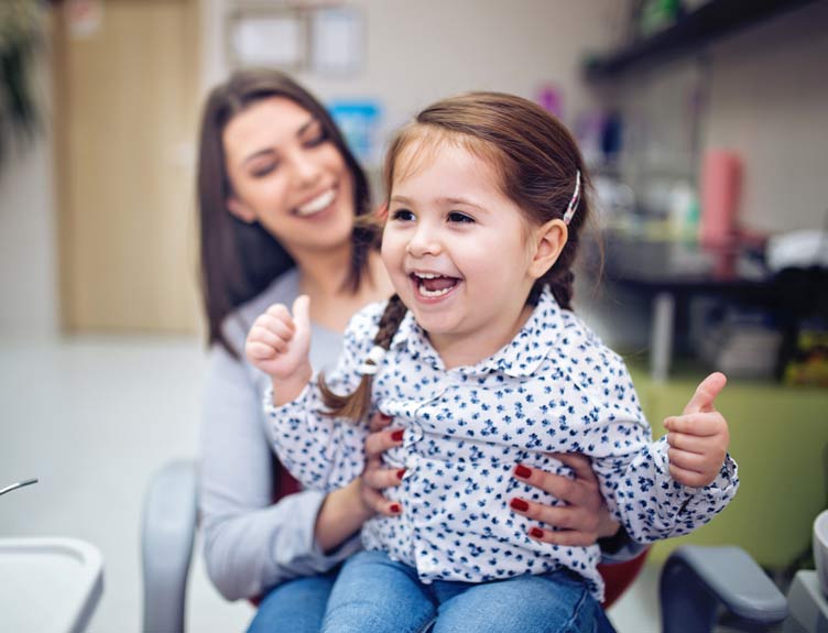 A child is happy playing with an adult