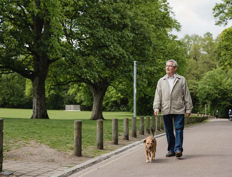 Man walking dog in park
