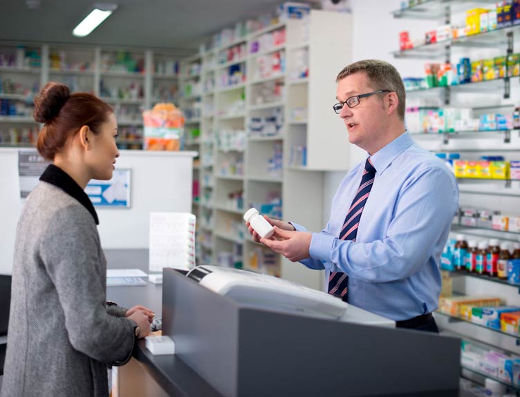 Pharmacist discussing medication with a patient