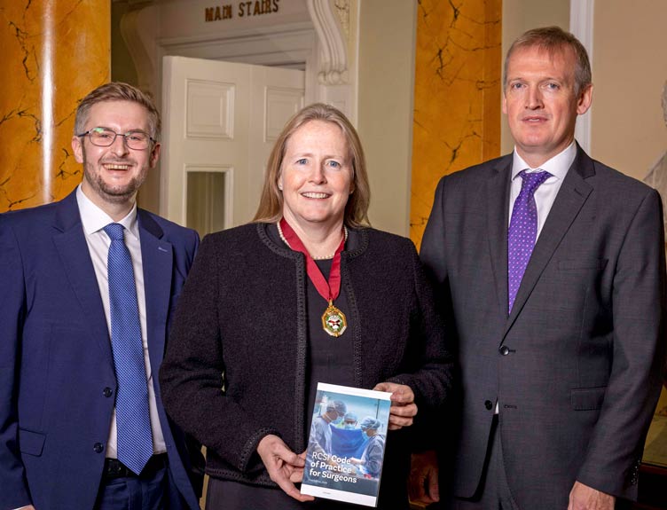 Three individuals present new printed version of RCSI Code of Practice