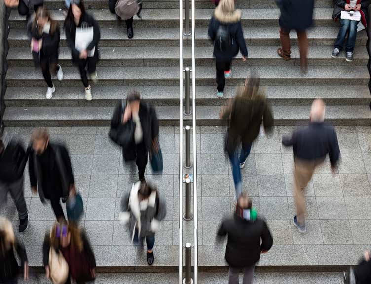 Busy setting of people moving along steps