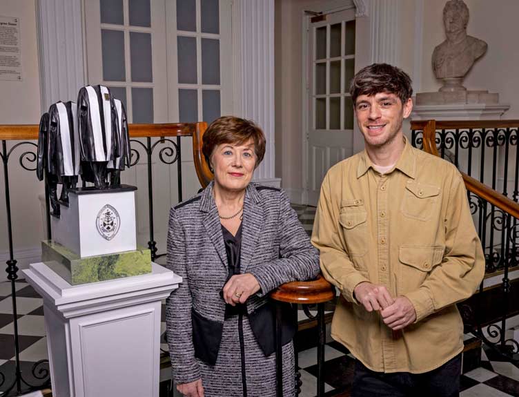 Artist and a Faculty Dean photographed with a sculpture to mark 50th anniversary of the Faculty of Nursing and Midwifery
