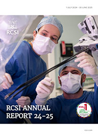 Cover of RCSI 24/25 annual report shows two young surgeons performing a procedure