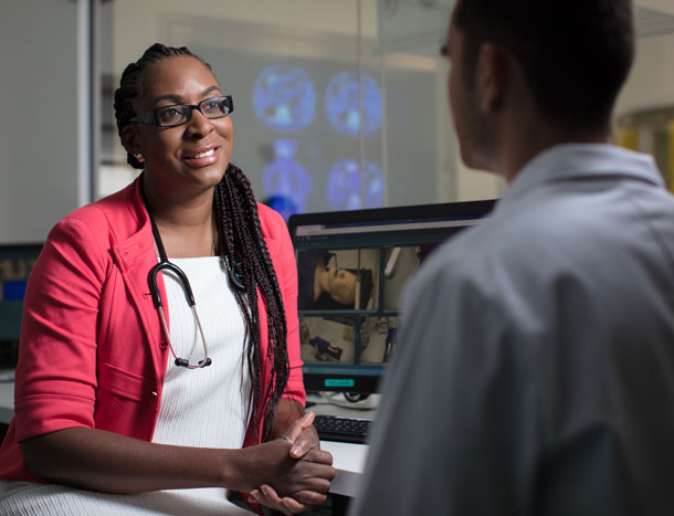 Clinician teaching student in simulated environment