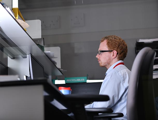 RCSI employee on computer