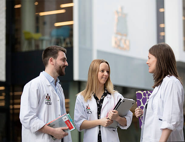 Undergrad students in white coats outside 26 York Street