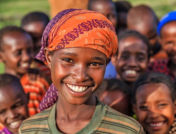 Smiling children pose for photograph