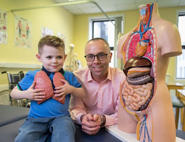 Four-year-old Alfie Dardis from Stepaside was on hand with Prof. Paul McNally, RCSI Associate Professor of Paediatrics & Consultant in Paediatric Respiratory and Sleep Medicine to help announce the first national paediatric Cystic Fibrosis research programme in Ireland between RCSI and the National Children’s Research Centre (NCRC). Four-year-old Alfie Dardis from Stepaside was on hand with Prof. Paul McNally, RCSI Associate Professor of Paediatrics & Consultant in Paediatric Respiratory and Sleep Medicine to help announce the first national paediatric Cystic Fibrosis research programme in Ireland between RCSI and the National Children’s Research Centre (NCRC).