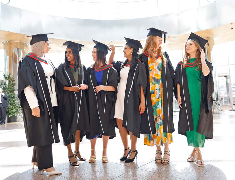 RCSI School of Medicine Conferring A group of graduates pose inside building