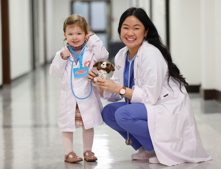 Teddy Bear Hospital Student and child pose with smiles during Teddy Bear Hospital