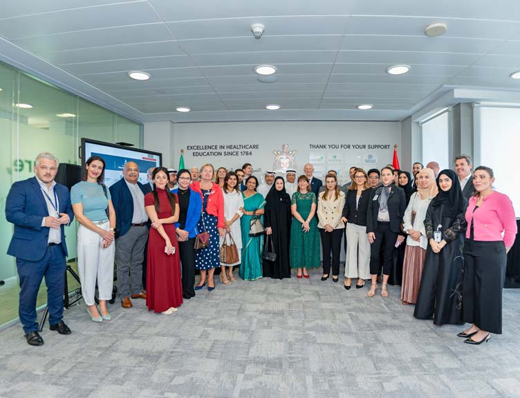 Dubai Healthcare City A large group pose for a photo indoors