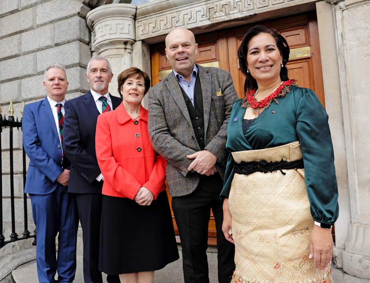 WHO Collaborating Centre Five individual pose outside a historic building