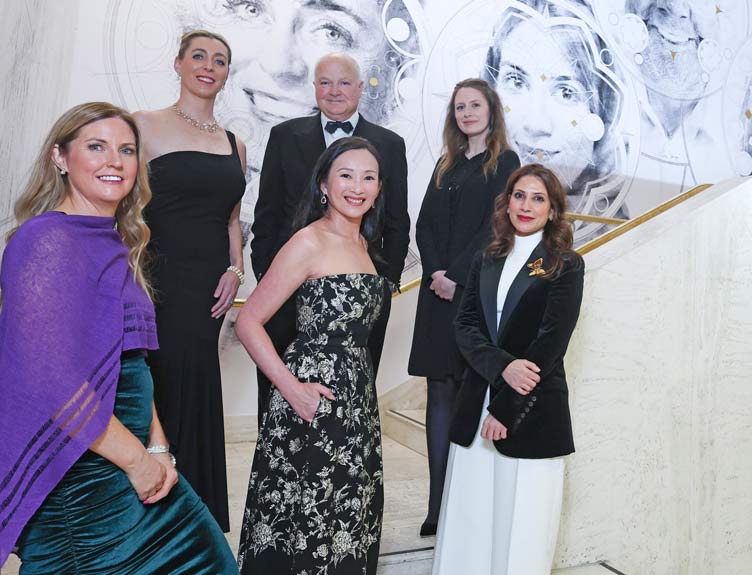 2024 Alumni Awardees Glamourous group of people pictured in front of artwork