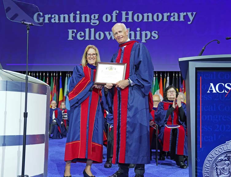 Two professors with Honorary Fellowship at ceremony