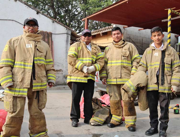 Firefighters in Guatemala pose for a photo
