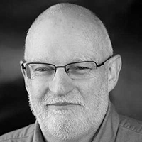 Pat Dolan headshot, black and white.