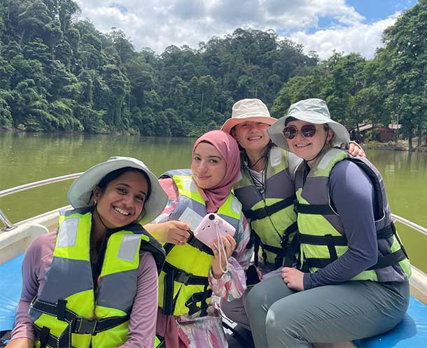 Students on a boat in Malaysia on OneHealth programme