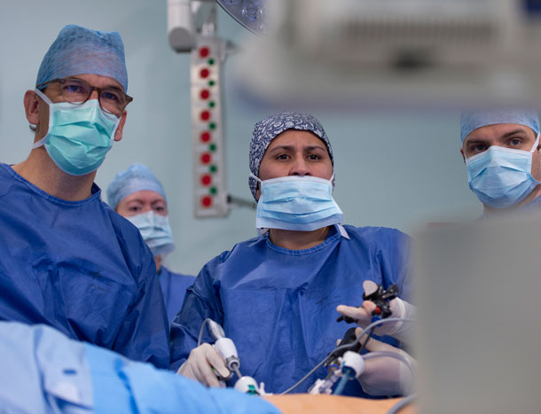 Arnie Hill and his surgical team in theatre - female leading surgery