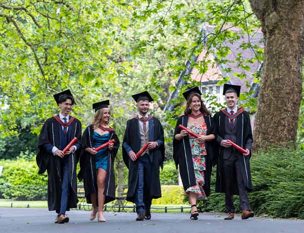 Graduating students walking in St Stephen's Green Park
