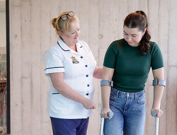 Nurse and patient with crutches