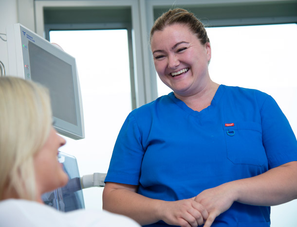 Nurse smiling at patient