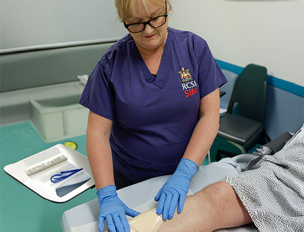 Nurse treating wound