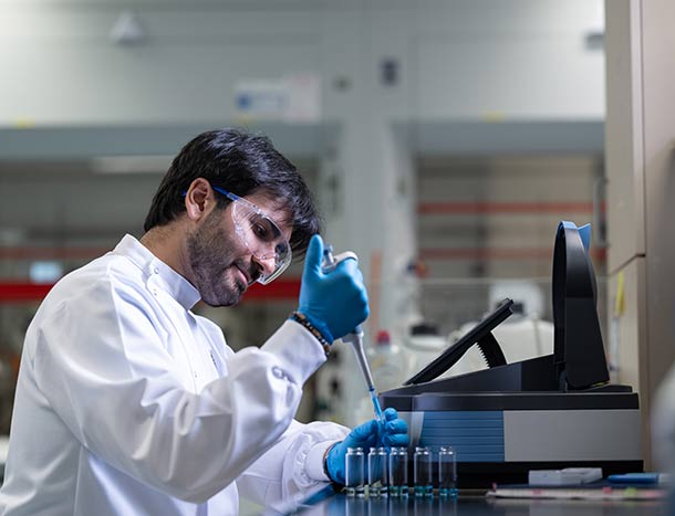RCSI researcher pippettes in a laboratory