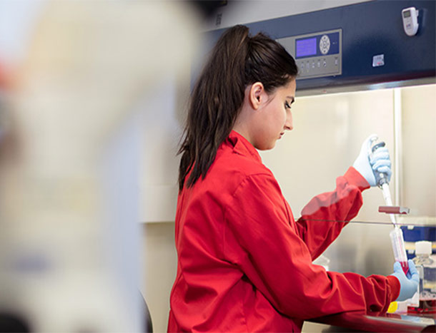 RCSI researcher in red coat