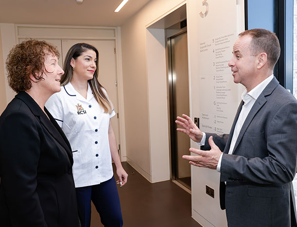 Senior nurses chatting in hallway