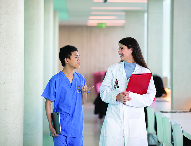 Student in scrubs and white coat in 26 York Street