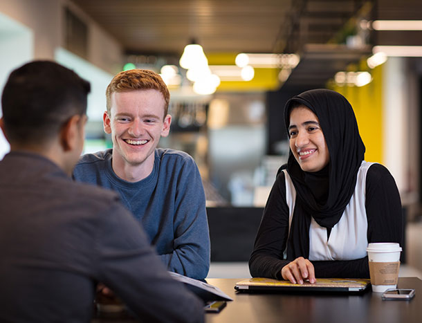 Students talking in cafe