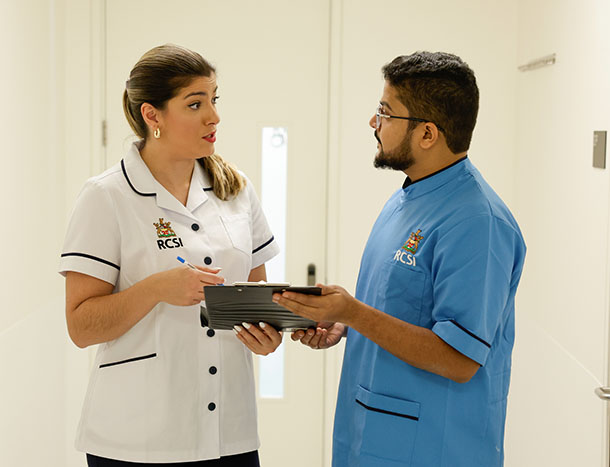 Two nurses looking at chart