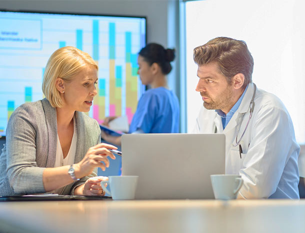 Doctor and hospital management discussing results