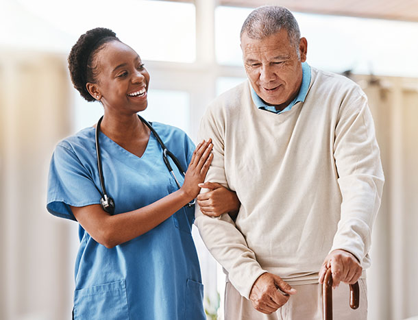 A nurse caring for an elderly man.