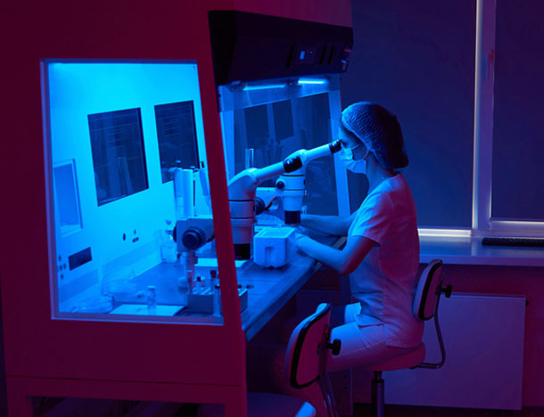Specialist embryologist works with biomaterial for cryopreservation