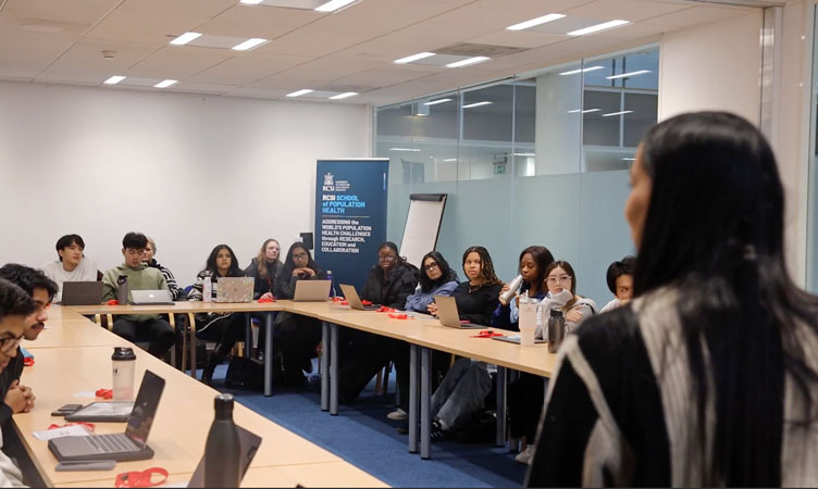 Group of students and tutor in discussion