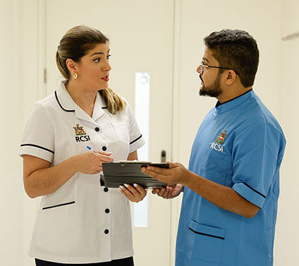 Two nurses looking at chart v2