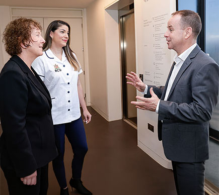 Senior nurses chatting in hallway
