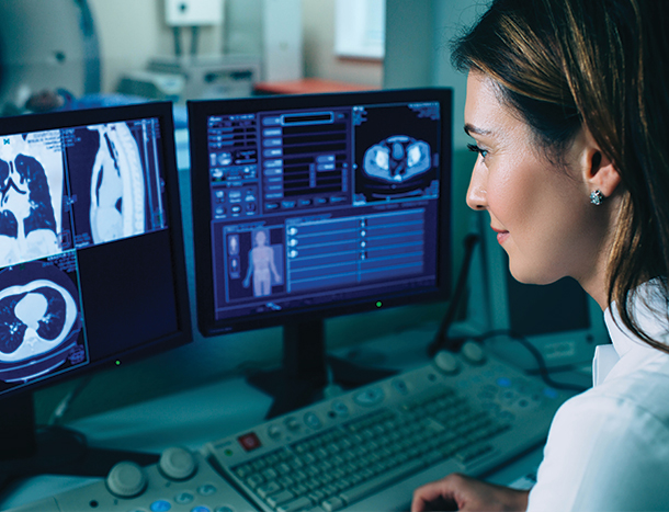 A medical professional looking at medical imaging