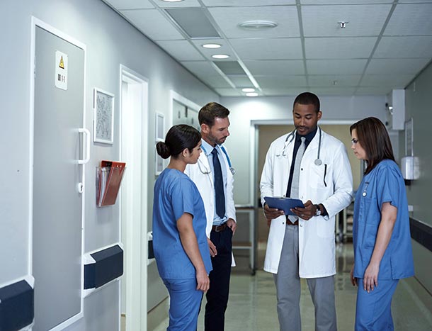 Doctors discussing a case file